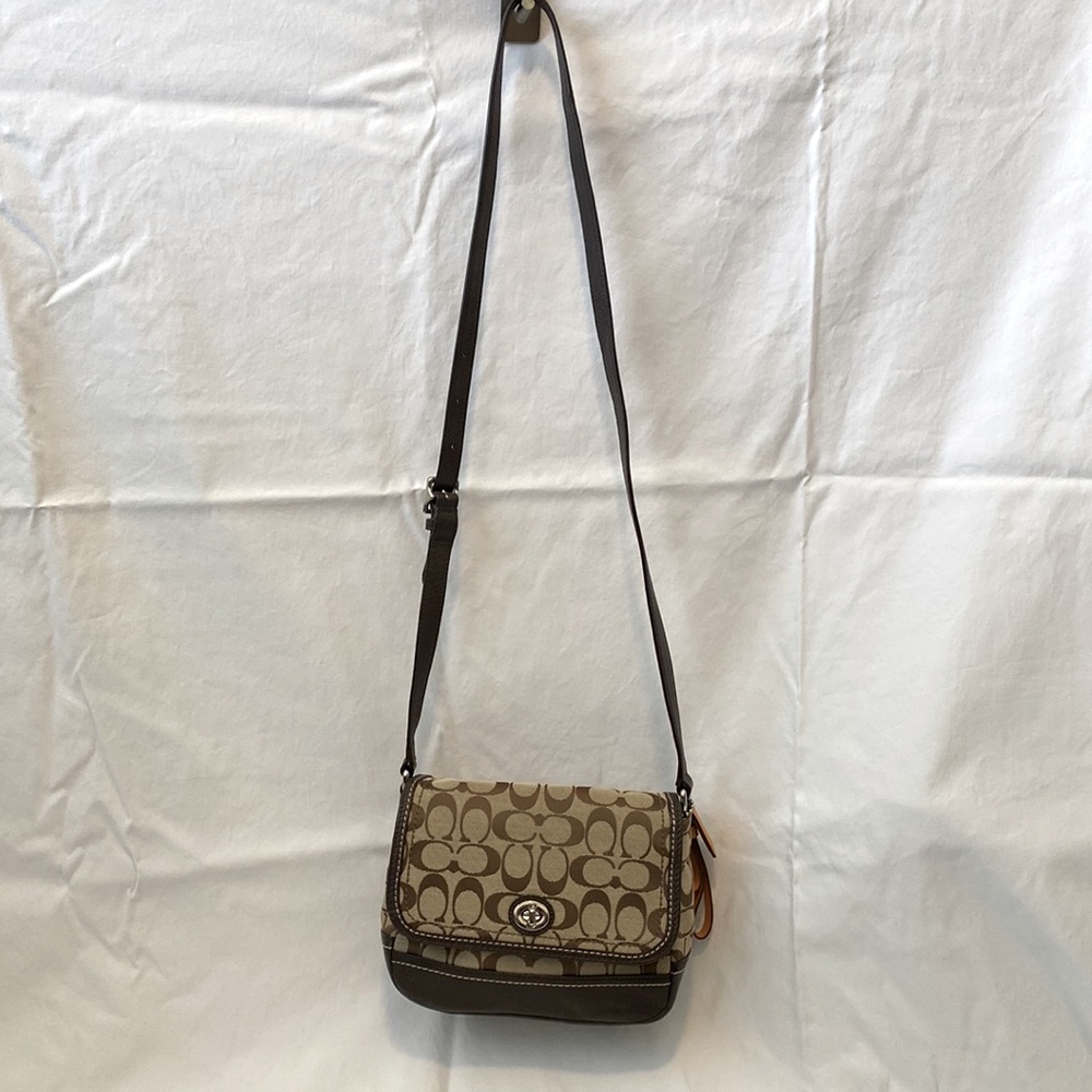 Brown and tan Coach handbag